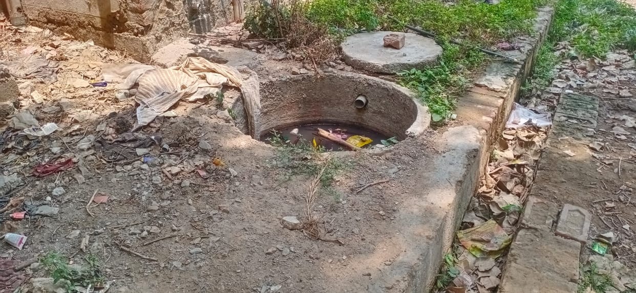 Darkness, filth, and broken roads in a colony of 1,500 flats