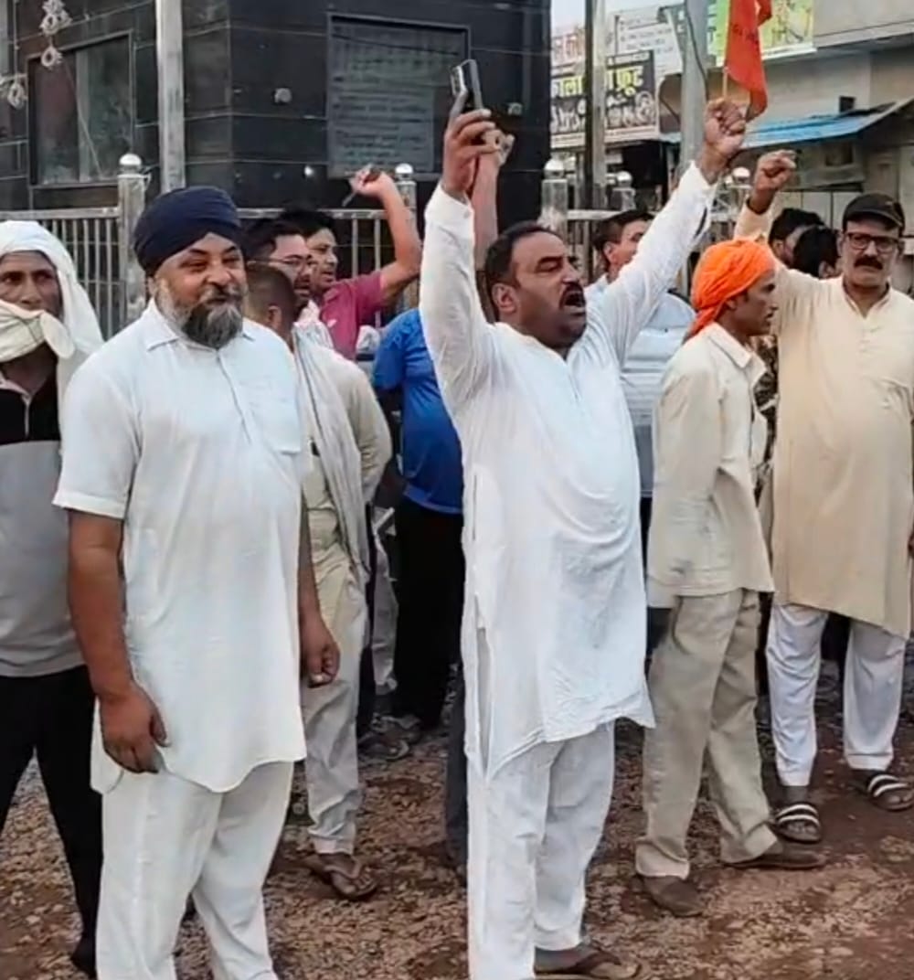 Protest against construction of road using paver blocks