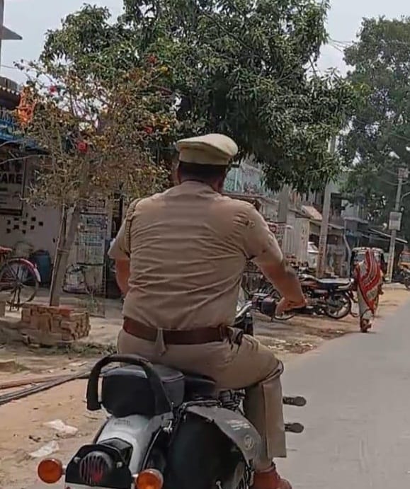 A police officer was fined Rs 1,000 for riding a bike without a helmet.
