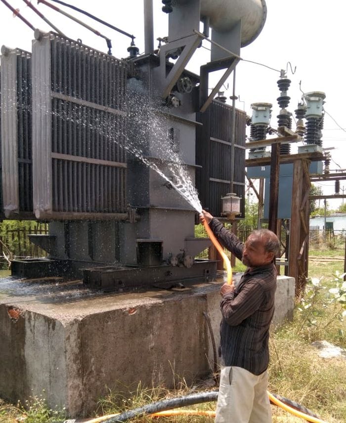 Transformers are being cooled by pouring water.