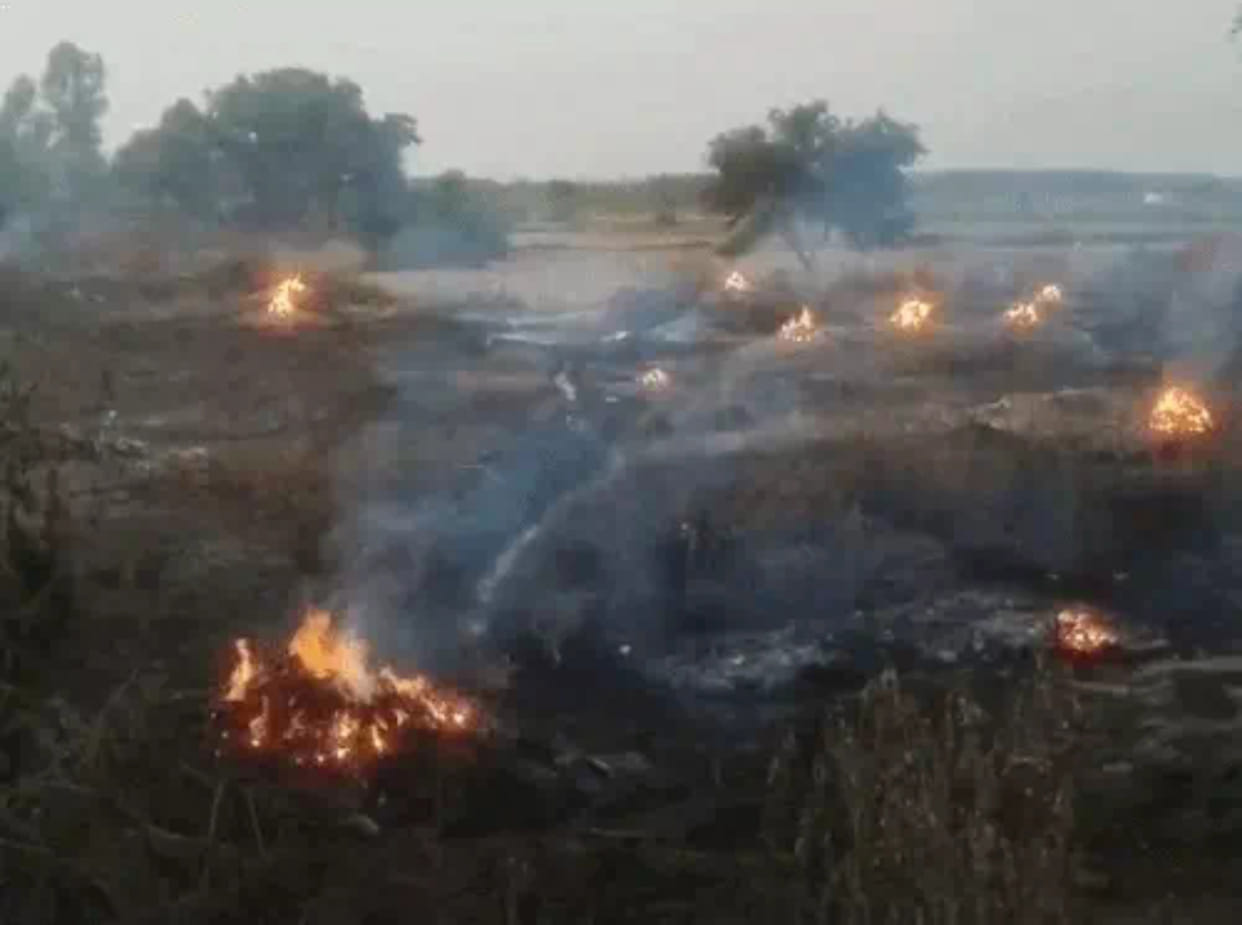 Fire in cow dung cakes and straw