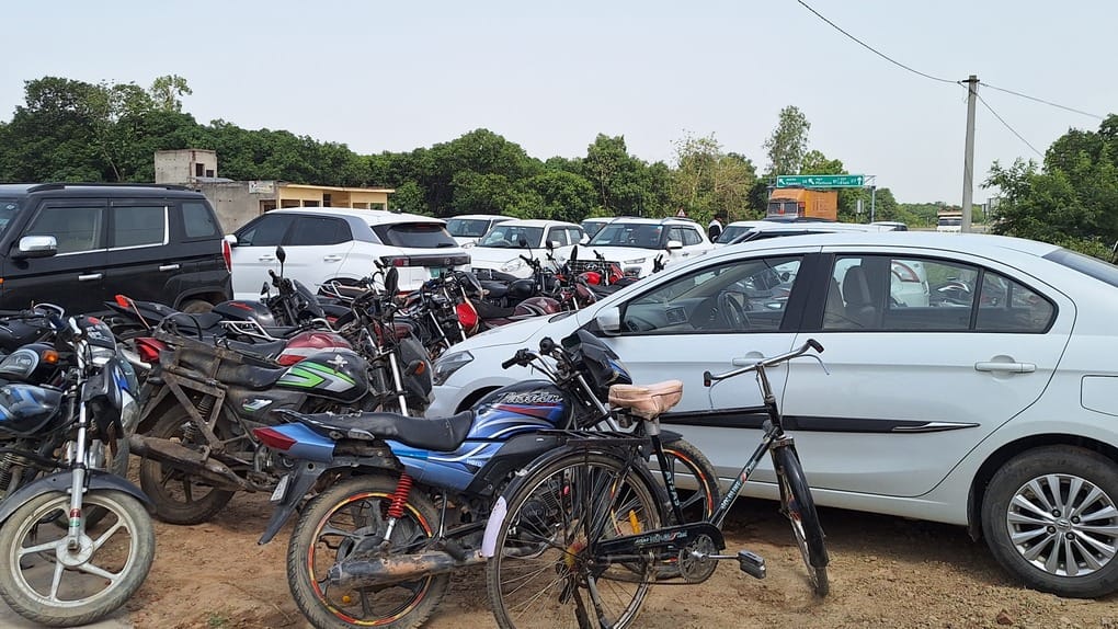 The MP who travels by public bus arrived with a convoy of over 20 cars.