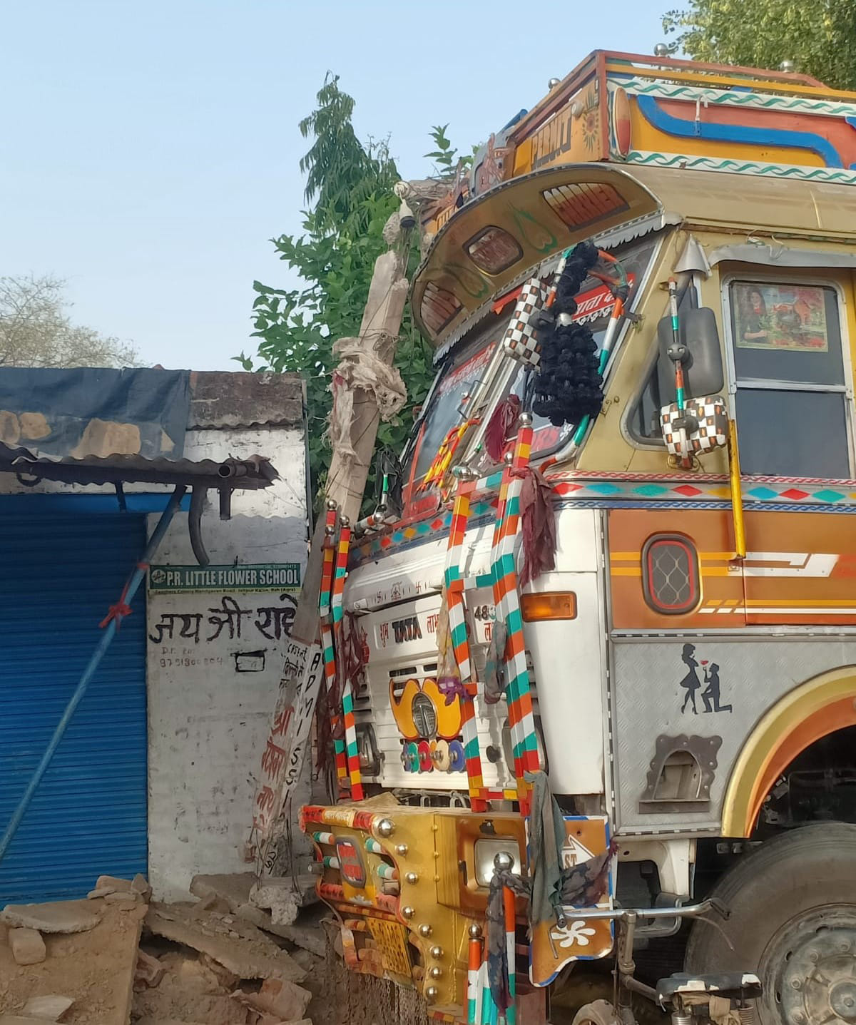 The out-of-control truck hit an electric pole, transformer and wall, damaging a house.