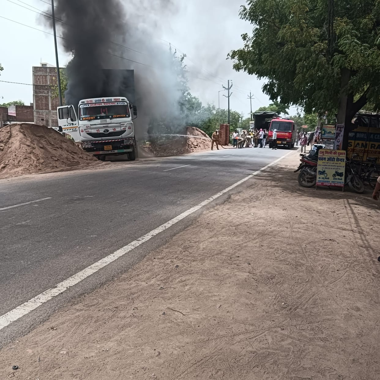 A dumper caught fire after coming in contact with a high-tension line.