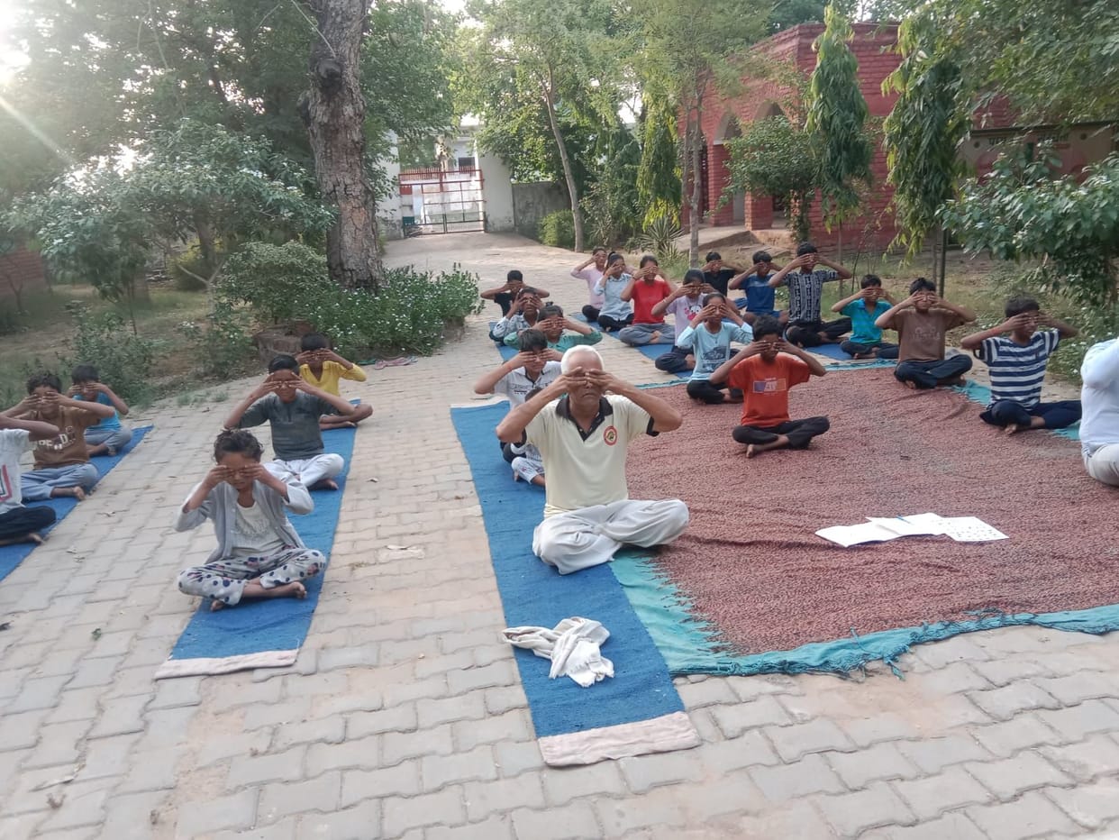50 children from Malra village are practicing yoga daily.