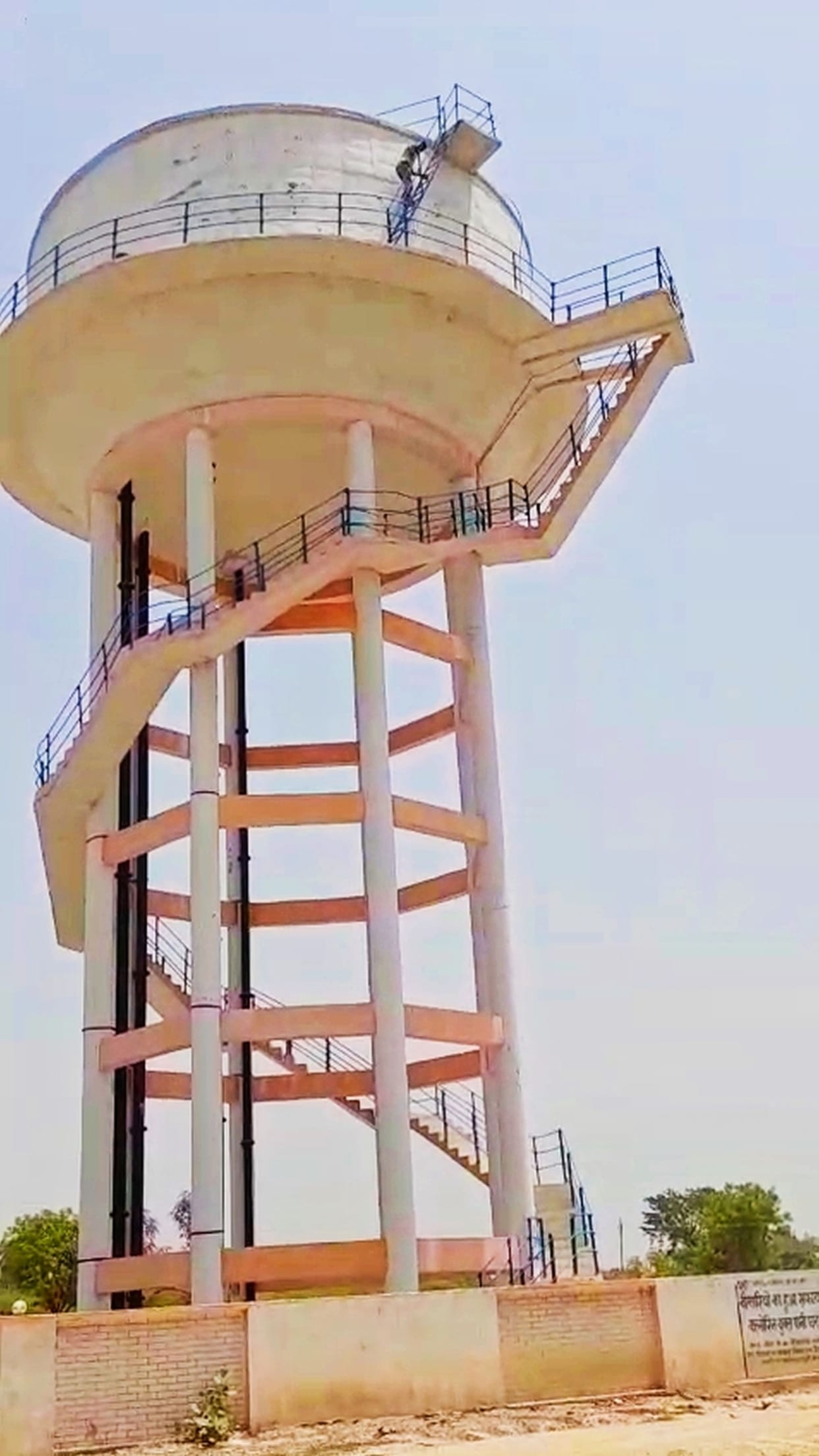 Man Climbs Water Tank Amid Dispute with Wife, Creates a Scene