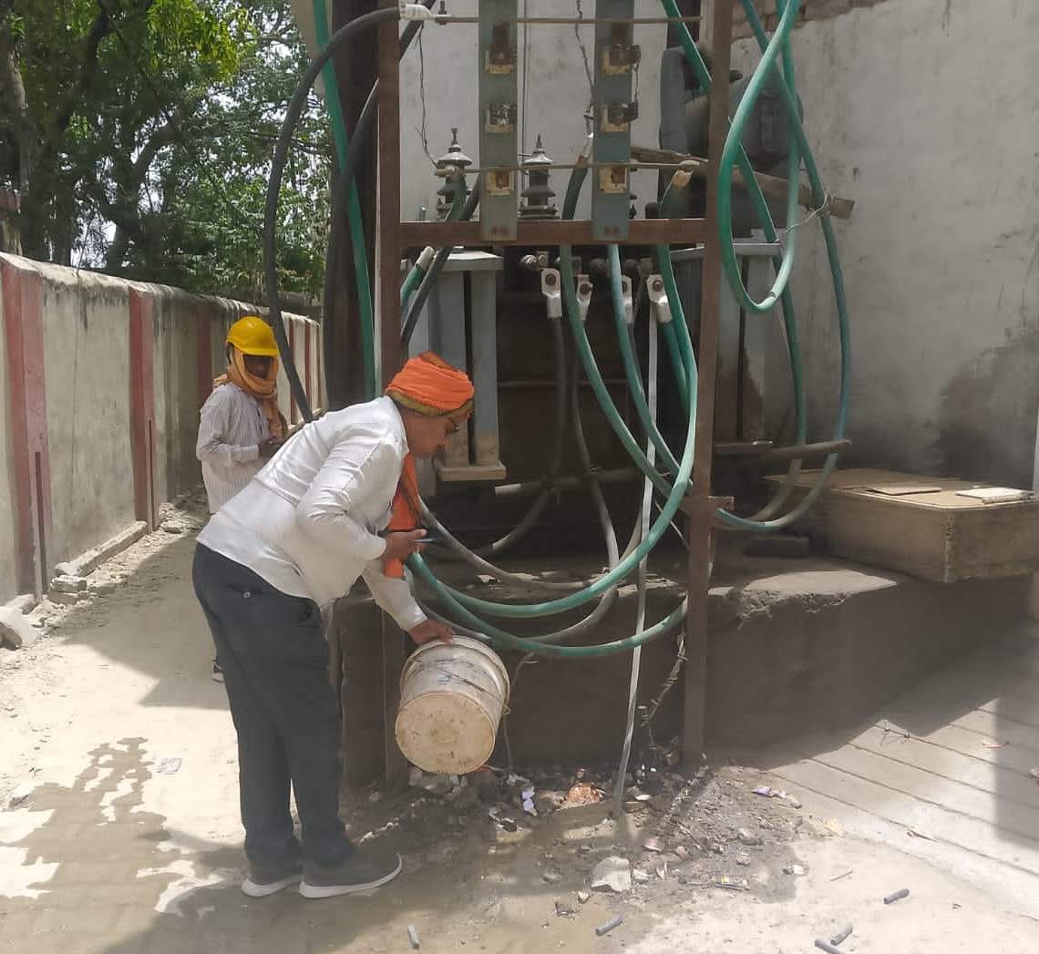 The transformer is not getting grounding, water is being poured to increase its capacity