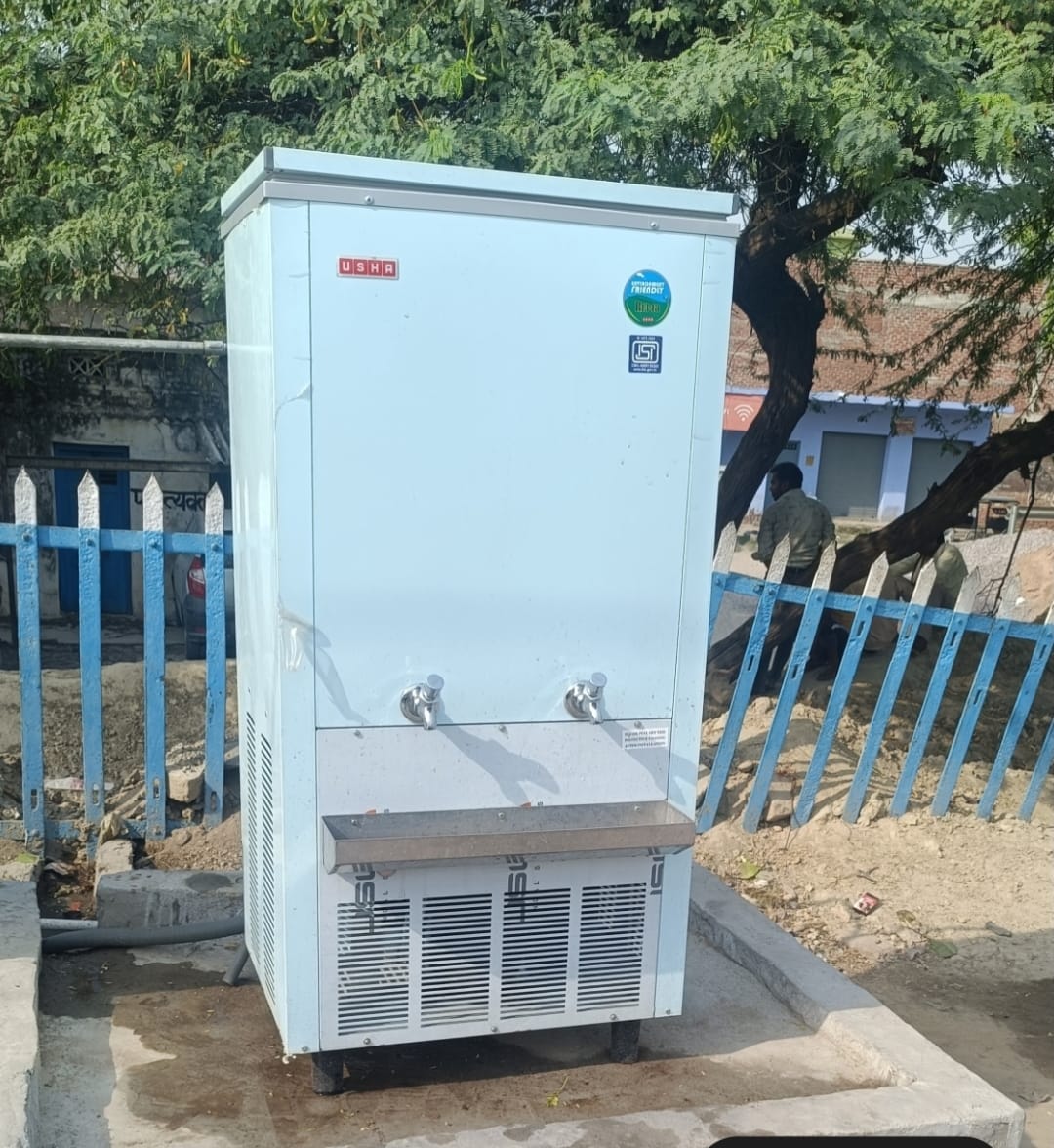 Hot water coming from the water cooler at the railway station