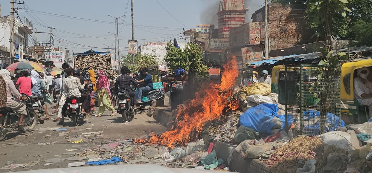 Heaps of Garbage Become a Menace in Pingawan; Choking Smoke Leaves Residents Gasping for Breath