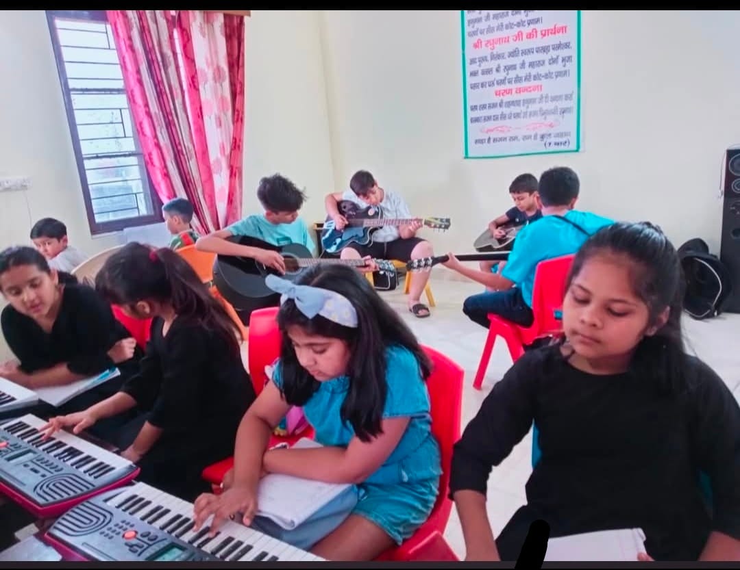 Children learned to play guitar at the camp.