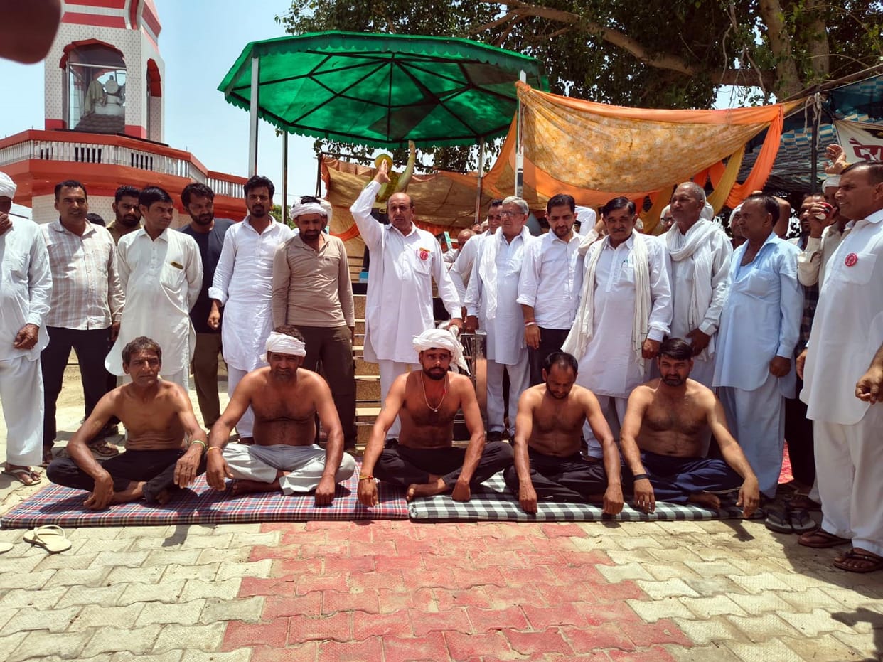 Farmers staged a semi-naked protest after not receiving cotton insurance claims