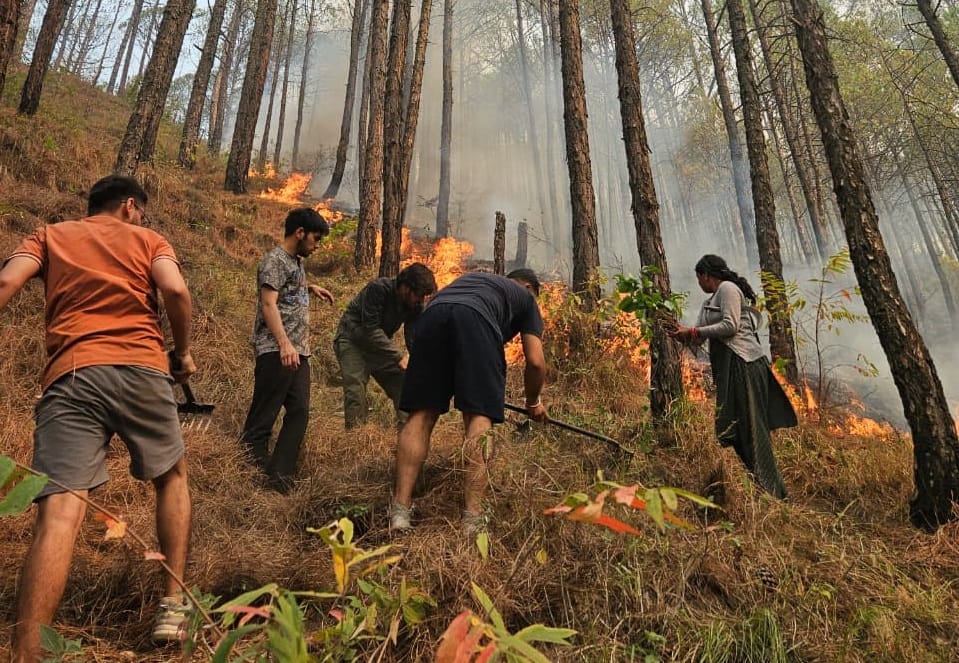 Standing through the flames all night, saving the village and school from burning.