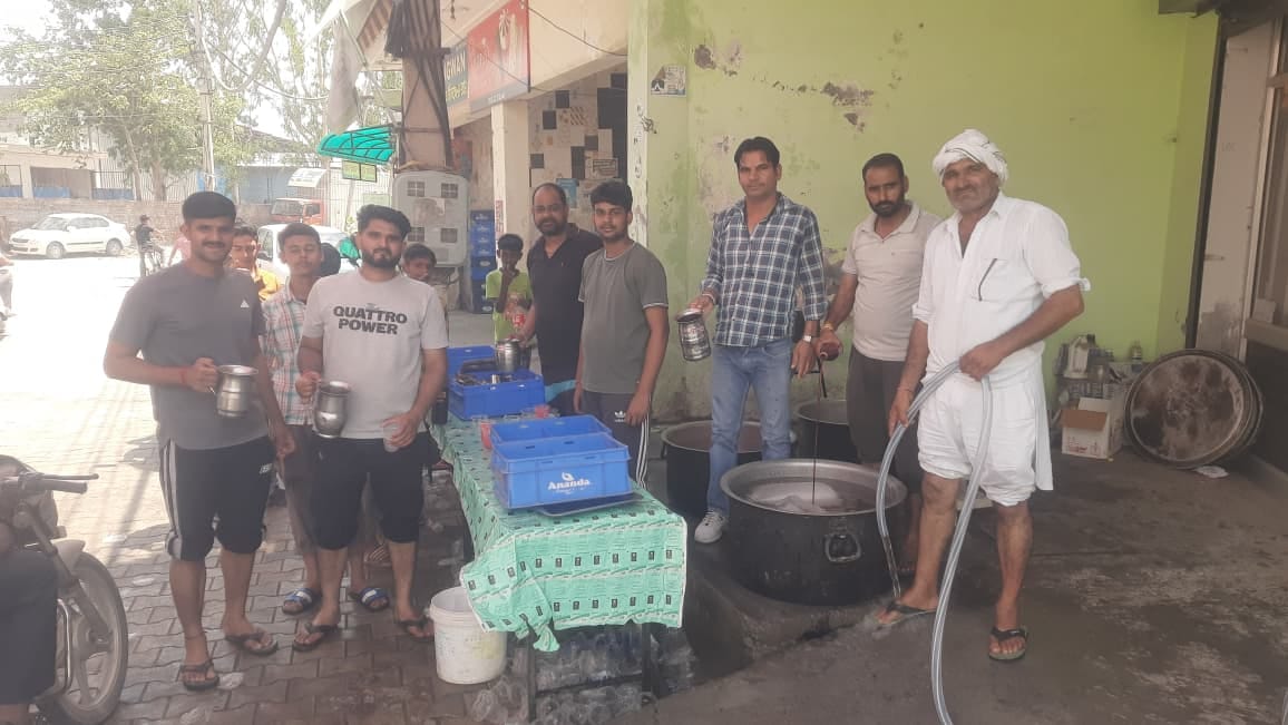 Villagers set up a sweet water stall
