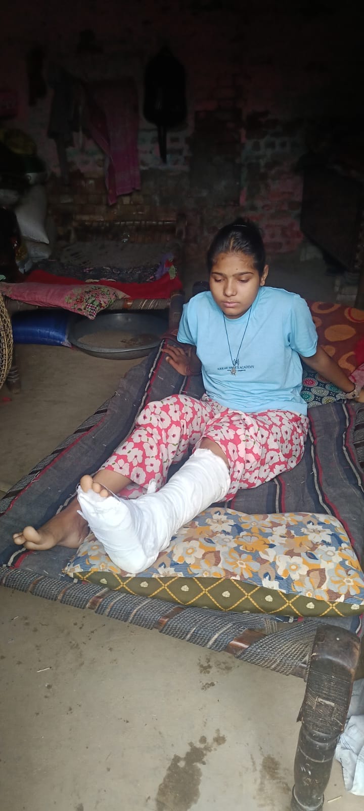 A young woman was injured after being crushed under the main gate of a crematorium during a storm.