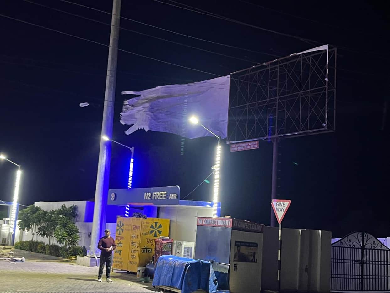 Power outages due to storm and drizzle, hoardings uprooted