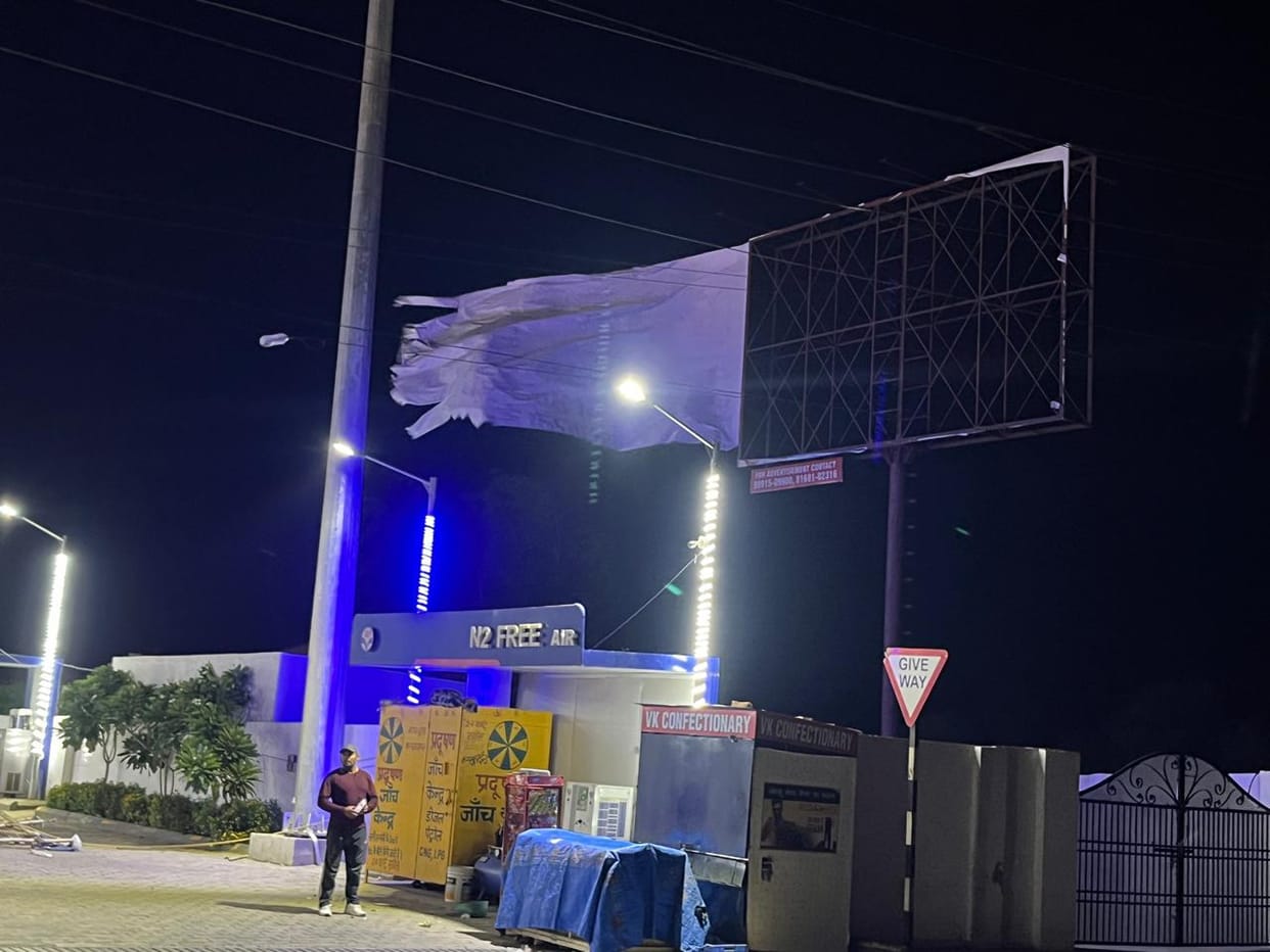Power outages due to storm and drizzle, hoardings uprooted