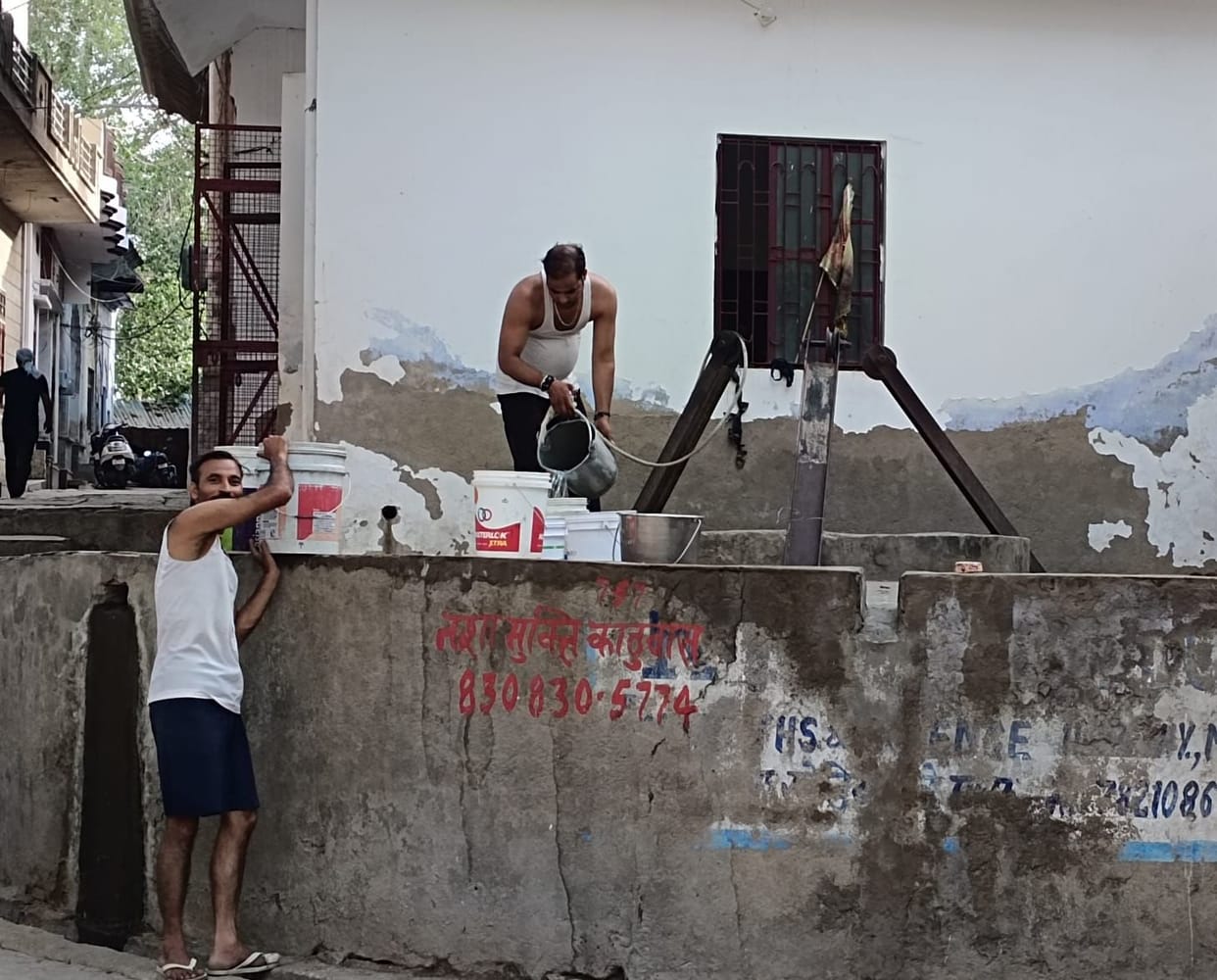 Even the rain failed to quench the thirst; waiting for canal water.