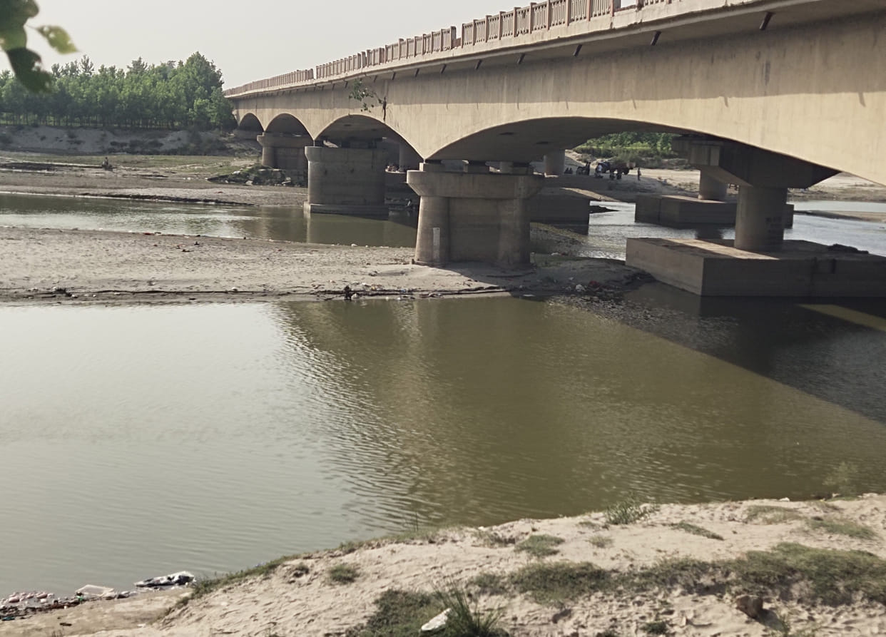 Yamuna thirsty in the scorching heat, the river's water stream shrinking amidst dry sand.