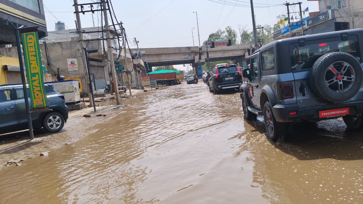 A pond forms again at Loharu Chowk, with the road submerged in more than two feet of water