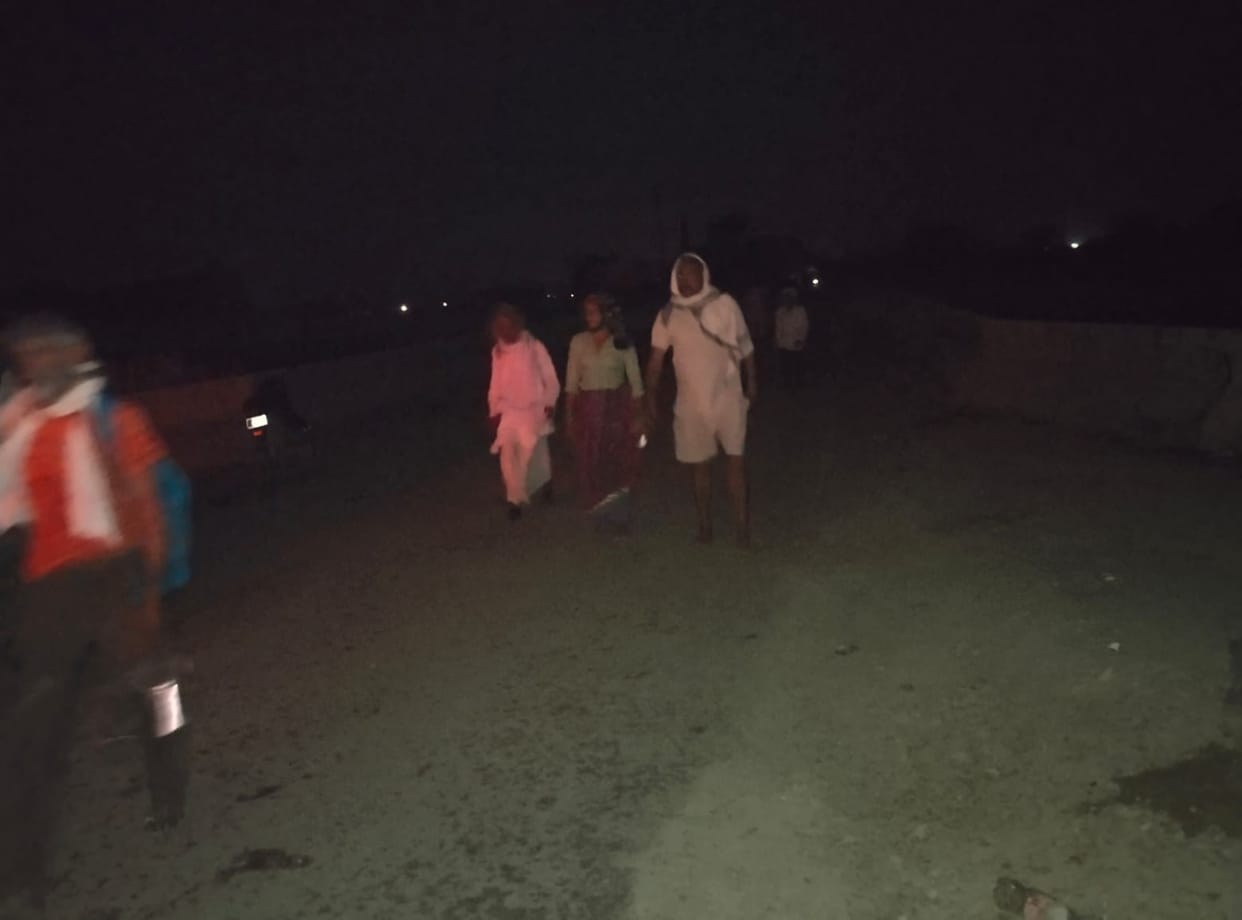 Devotees performing the circumambulation in the dark, aided by torches