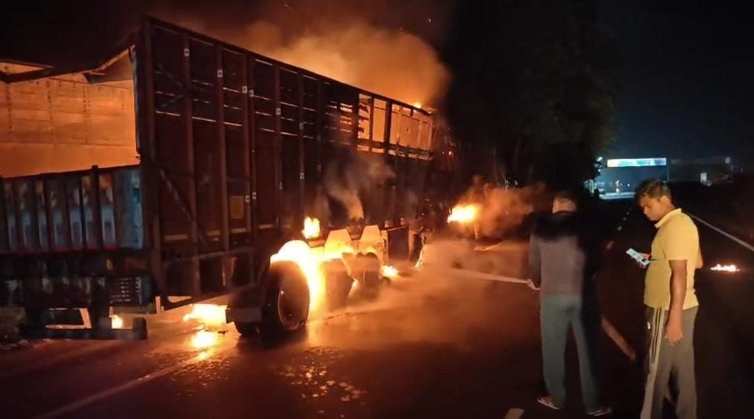 Two trucks catch fire on the highway.
