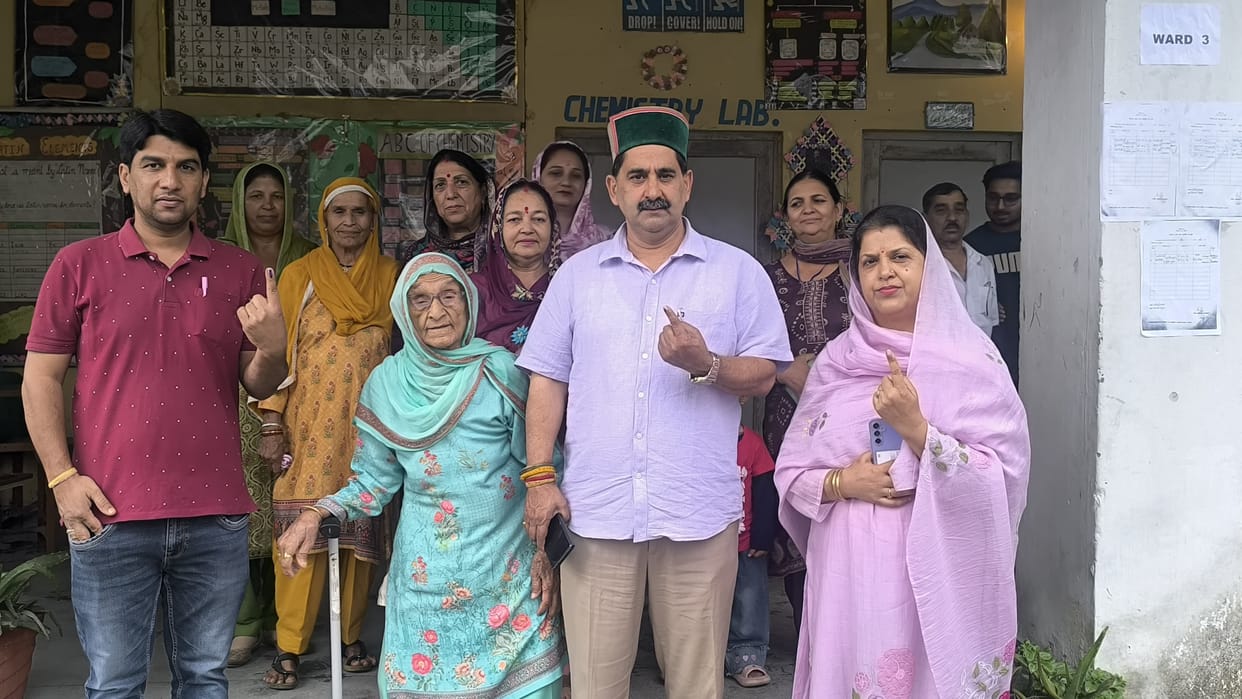 MLA Kewal Singh Pathania casts his vote along with his family.