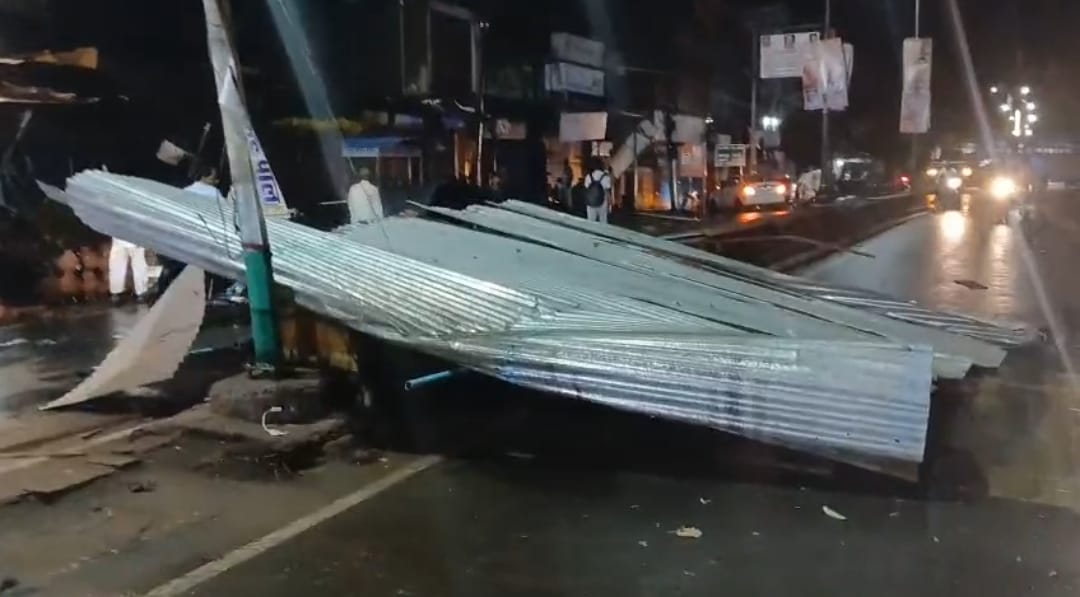 Heavy rain accompanied by thunder and lightning, flooding the streets