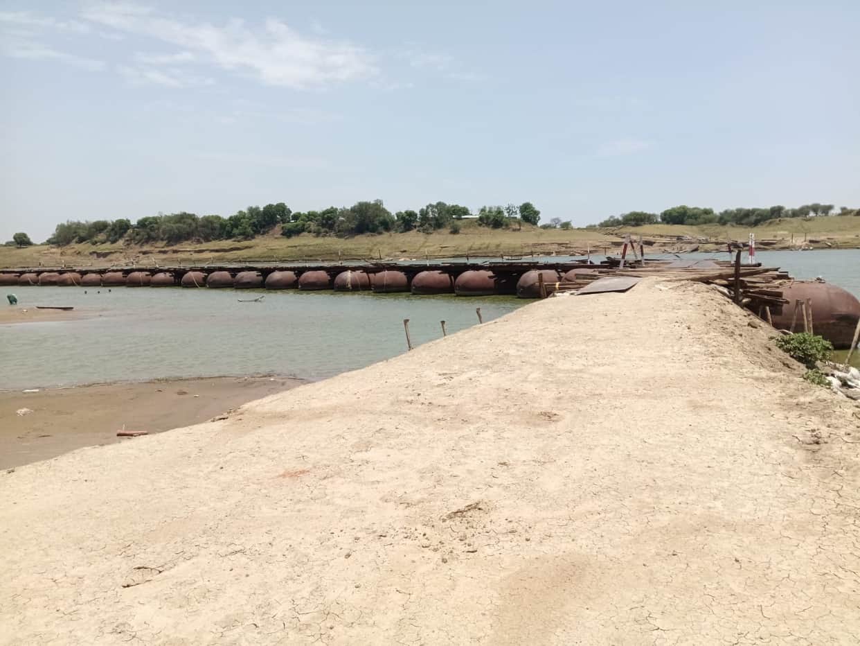 A storm swept away a pontoon bridge, disrupting communication with Fatehpur.