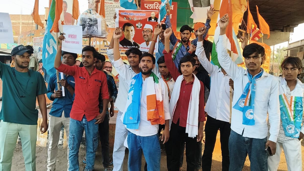 NSUI workers burn effigy of Education Minister.