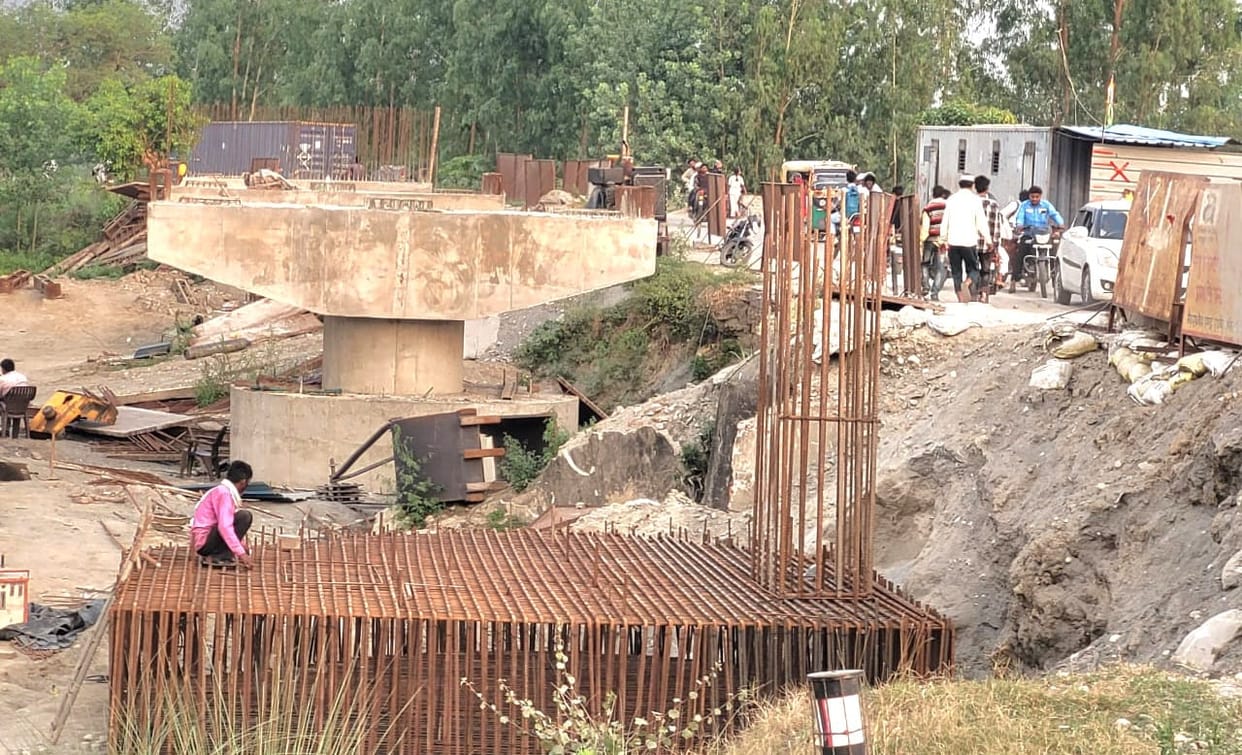 Rain is on the horizon, bridge construction is not complete.