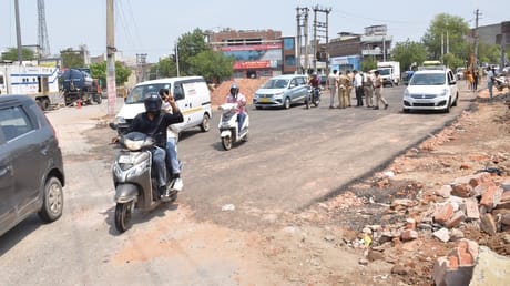 A road was built overnight to ease traffic jams, but tension persists in Nehru Colony for the third day.