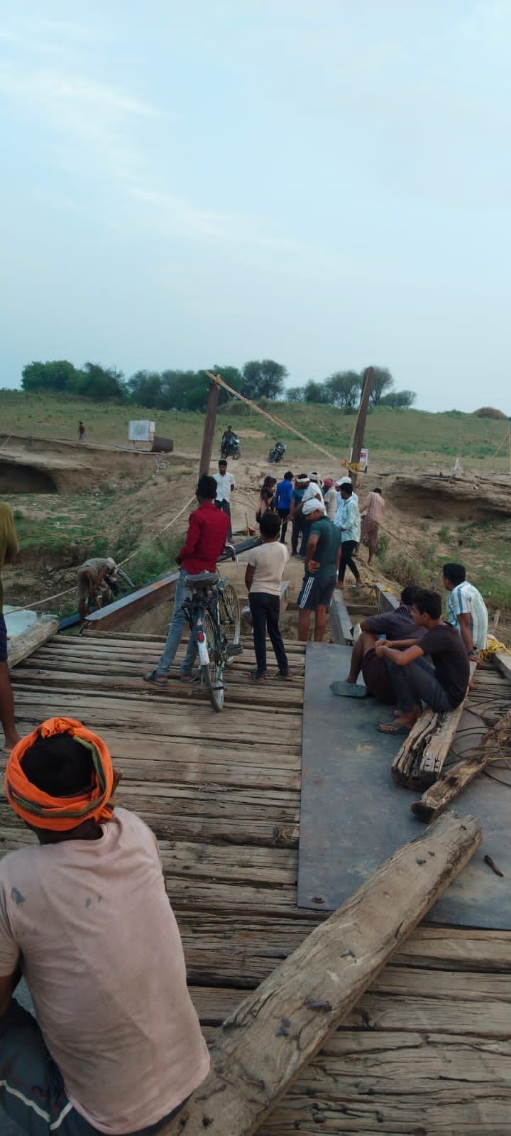 Repair work begins on the Aadauli-Madauli bridge that was washed away in the storm, hundreds of passengers are troubled.