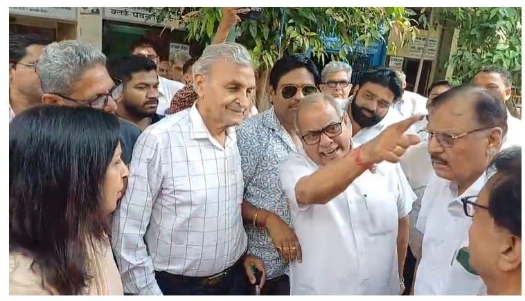 Uproar ensued at the inauguration of a water cooler, and the chairperson returned.