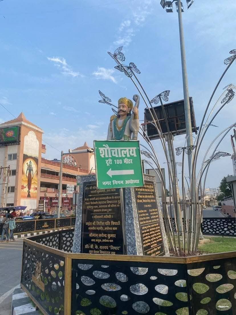 Questions Raised Over Placement of Toilet Signboard in Front of Nishadraj Statue