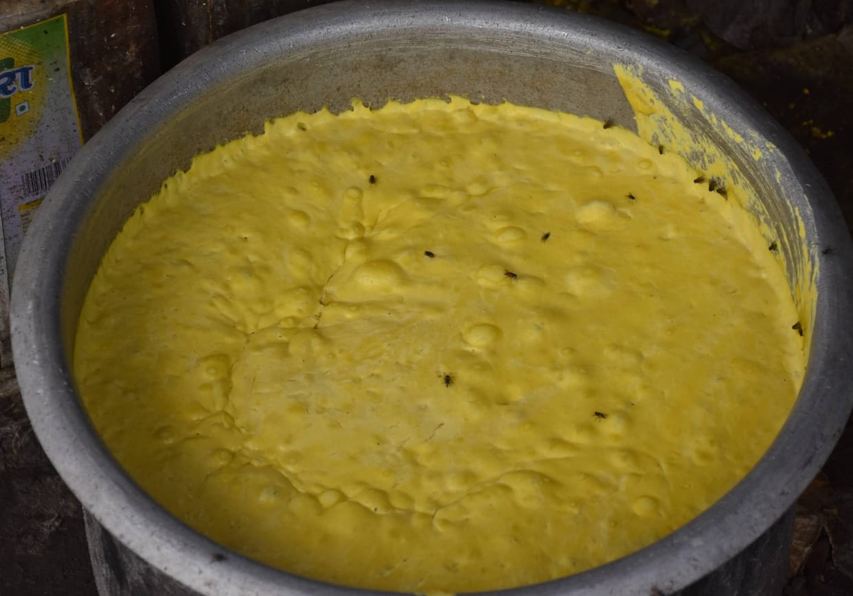 Breakfast of Disease" at Aligarh Junction
Flies in the gram flour, fritters in the dirt