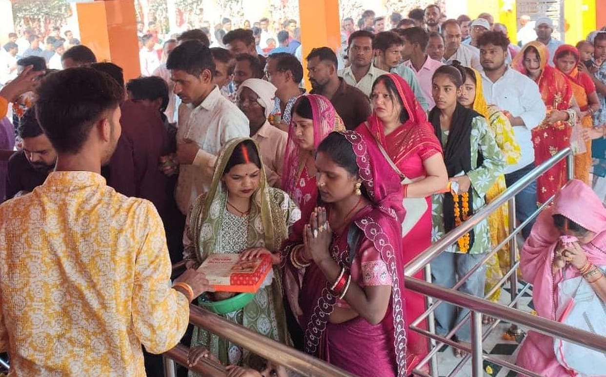 The devotees bowed their heads at the feet of the Mother Goddess.