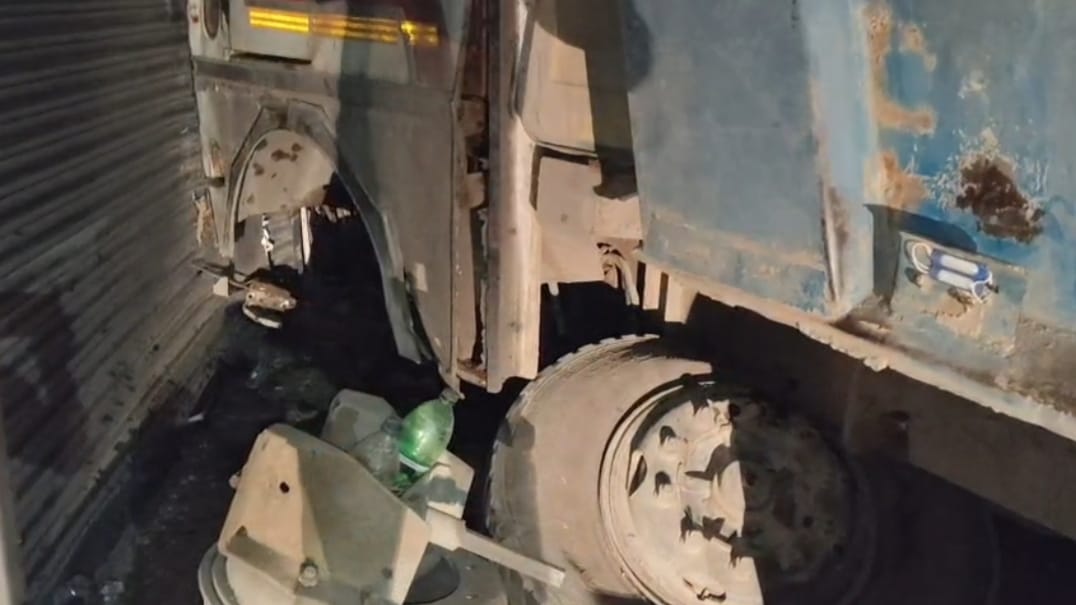 A gravel-laden dumper went out of control and crashed into a row of shops