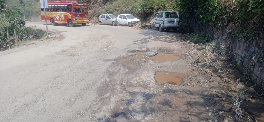 Potholes on the Brahmapukhar-Nalwad road