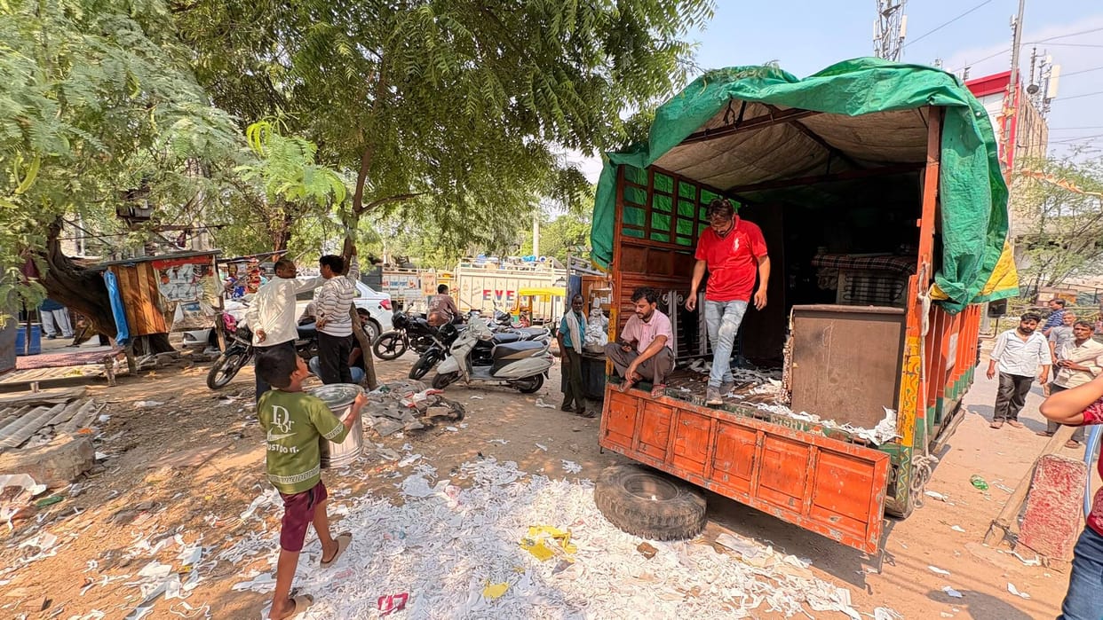 Fearing vandalism, people are loading their belongings into vehicles from Nehru Colony.