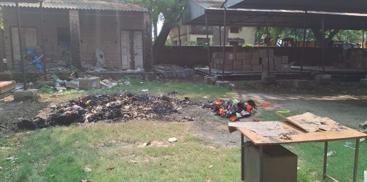 The DM arrived after seeing smoke rising from the Jal Nigam store; an FIR was lodged against four people, including the XEN, for burning kits and records.