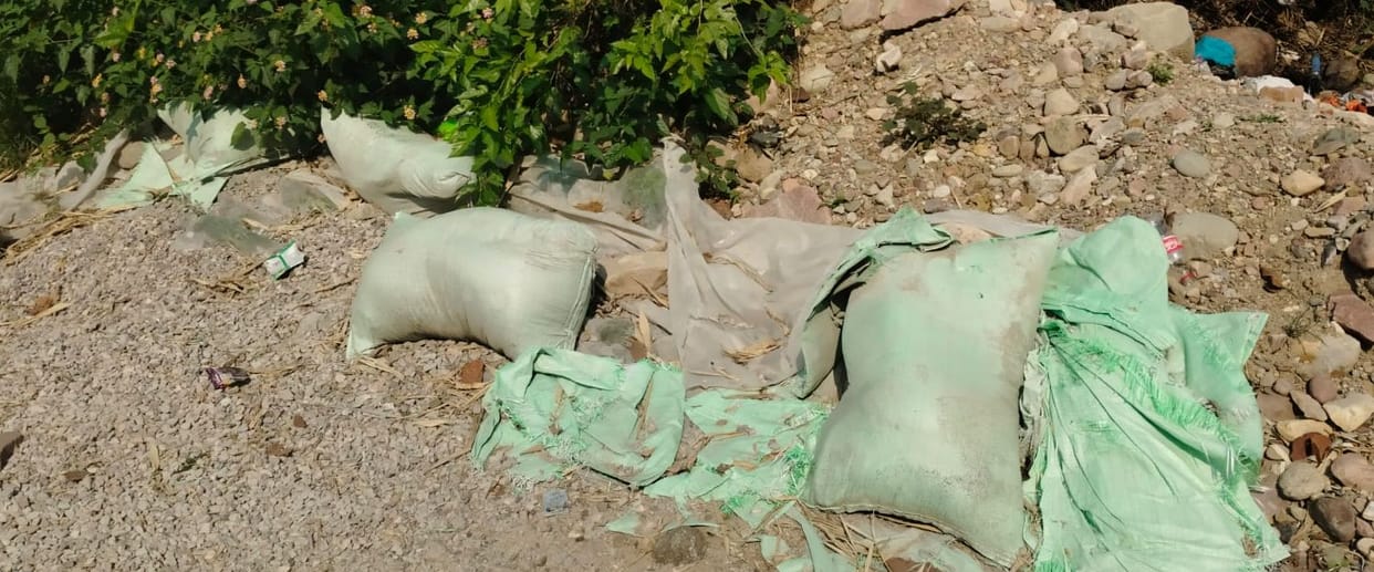 Government cement bags thrown near the military canteen in Sandhol