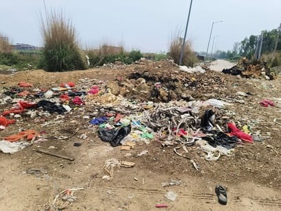 Mud on roads, foul smell emanating from garbage in plots