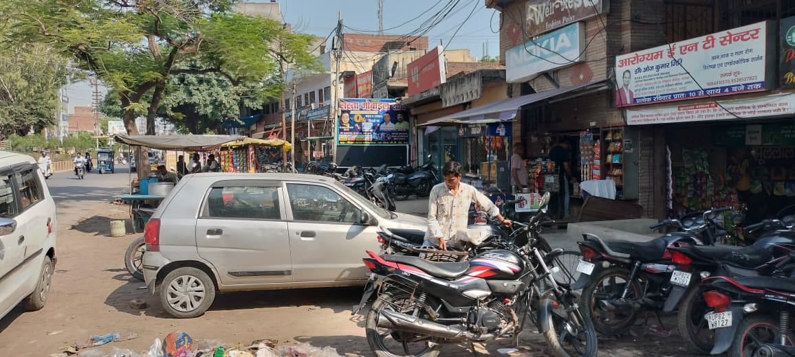 Shops behind, encroachment ahead