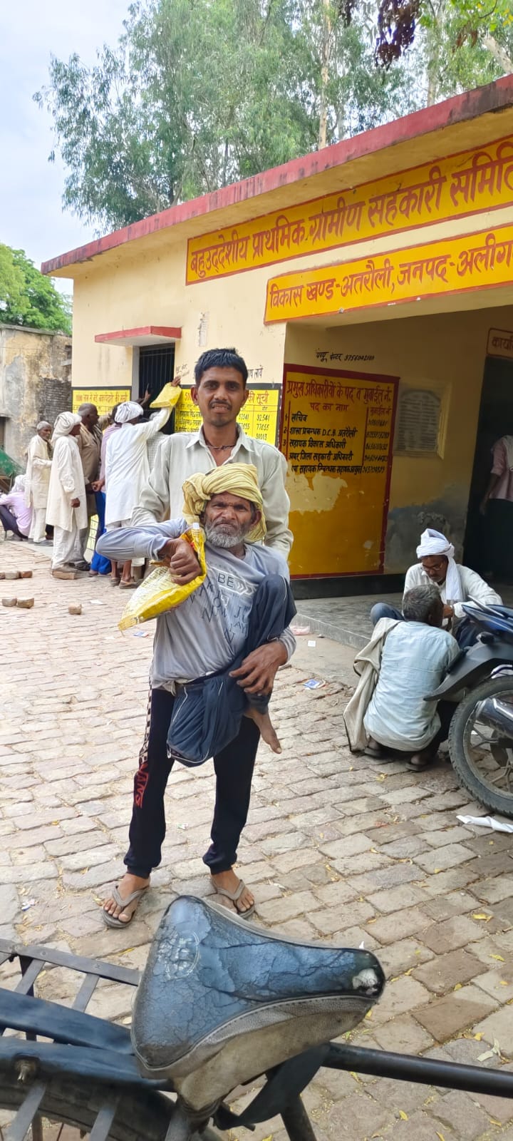 Nephew Carries Differently-abled Farmer in His Arms to Get Urea