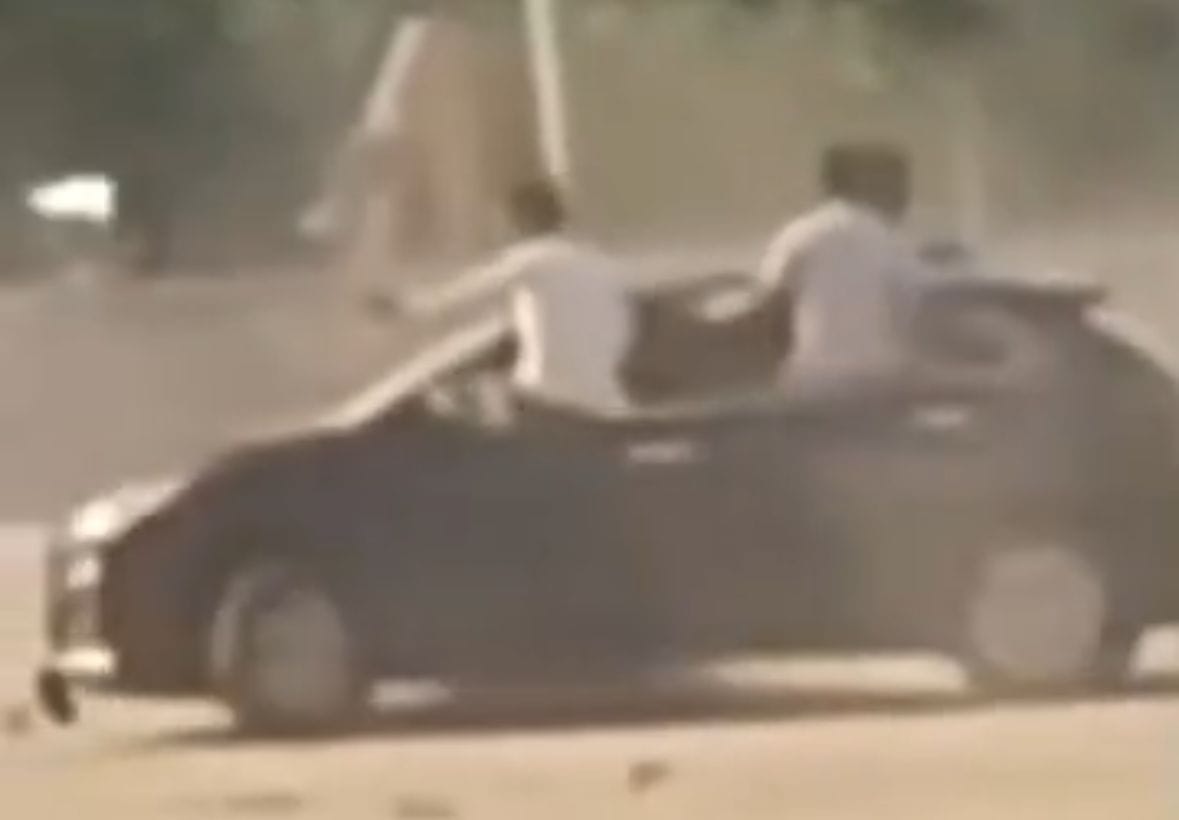 Youth performs stunt by jumping out of moving car windows, video goes viral