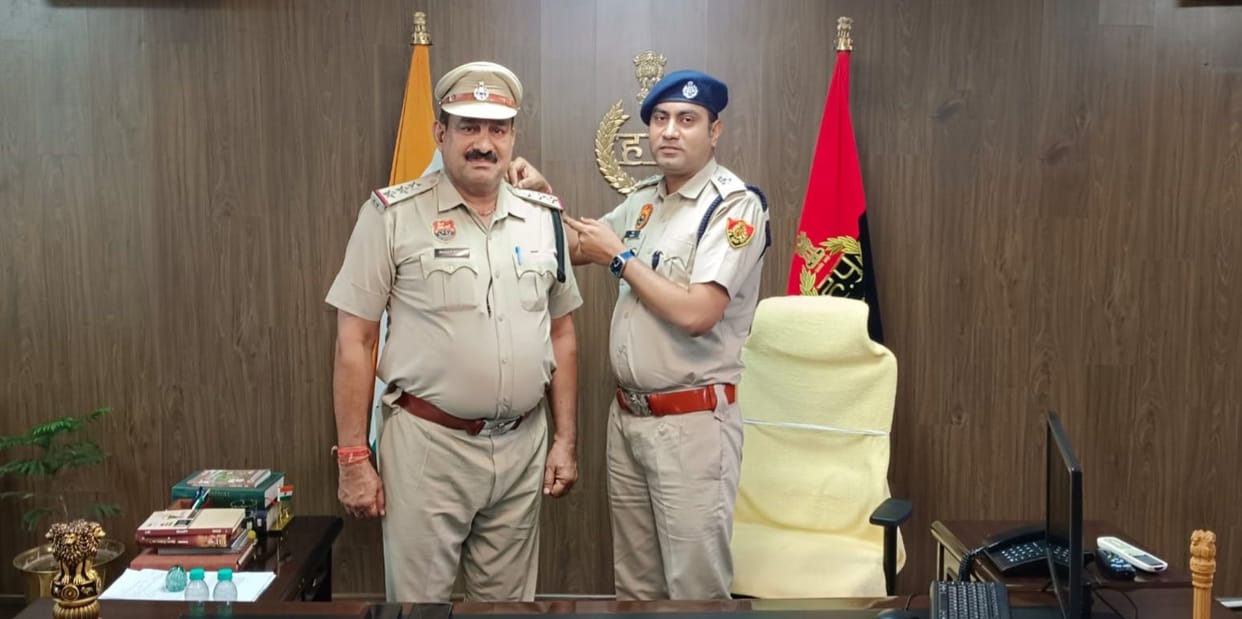 Two police officers were promoted to the rank of inspector.