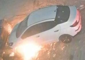 A car parked outside the house was set on fire