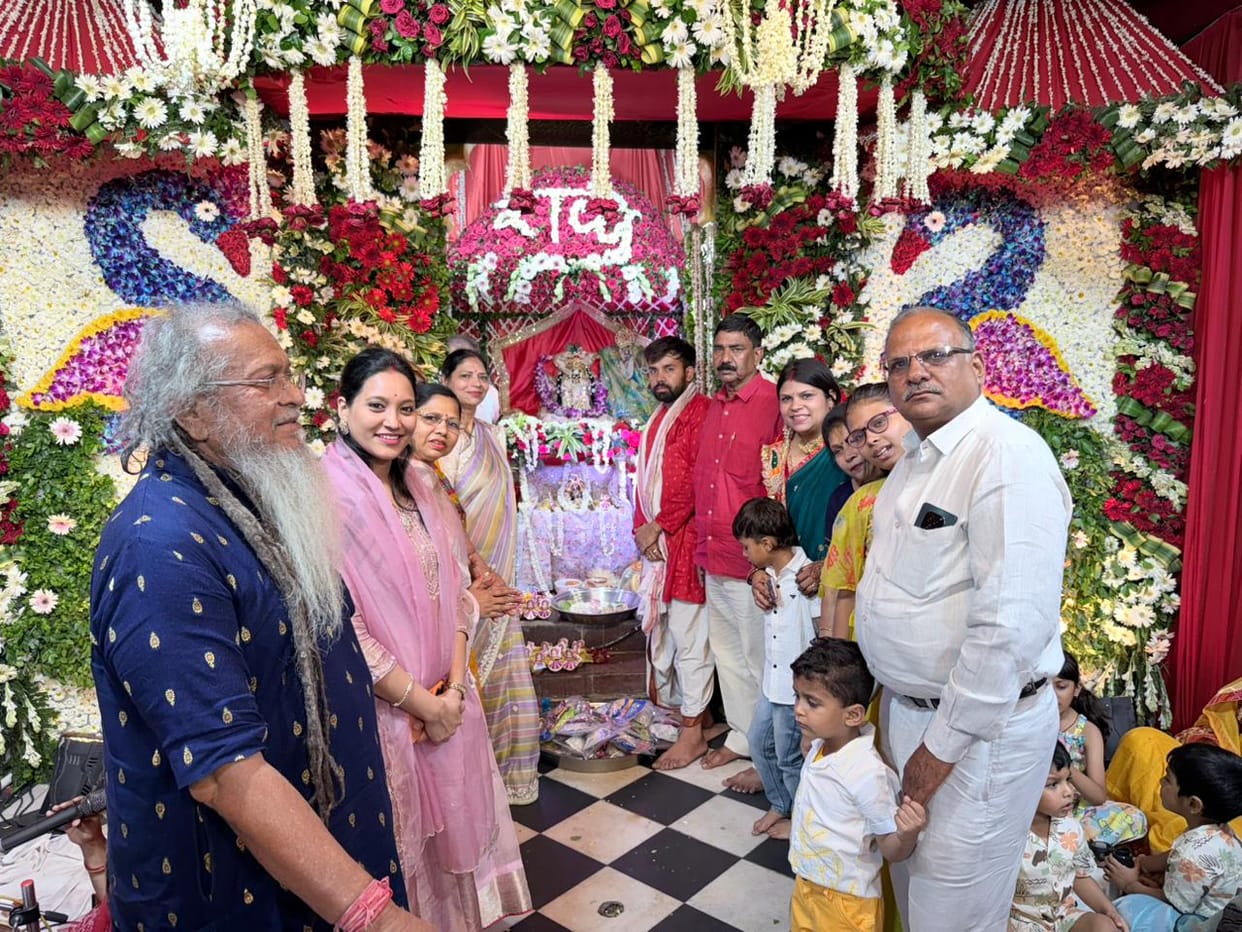 Thakurji swings in a cradle decorated with flowers, cheers echo
