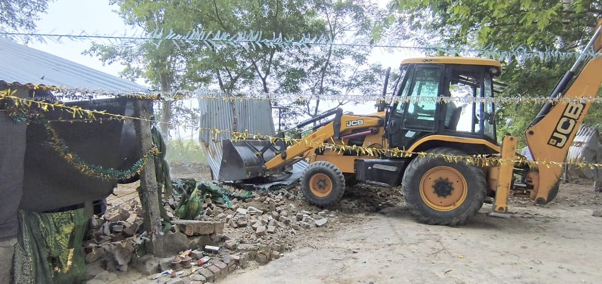 Bulldozer runs on the house of the murder accused built on government land