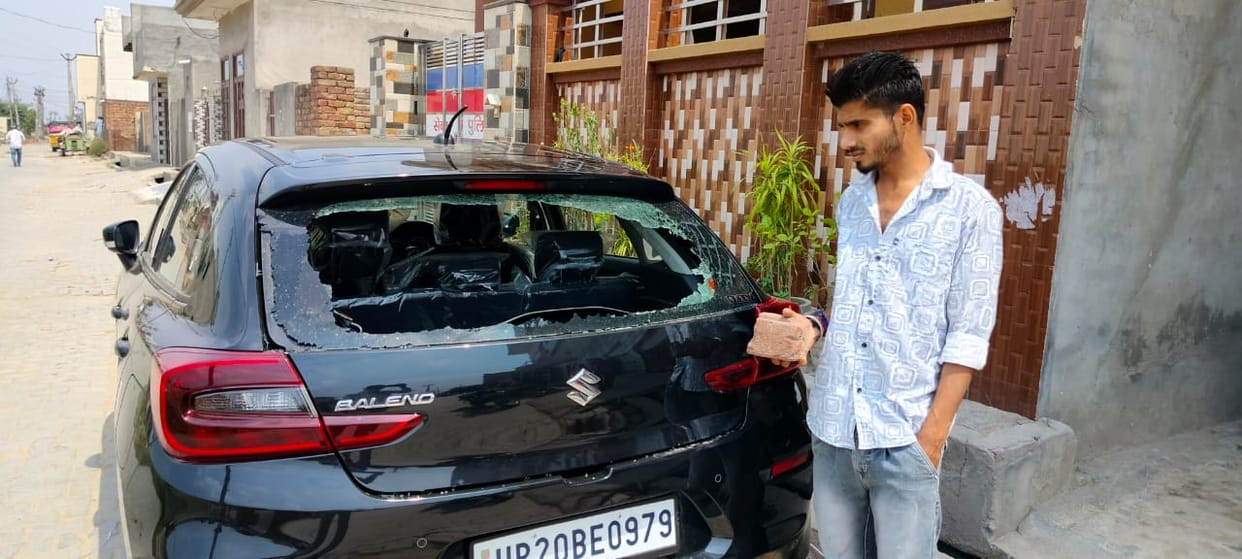Accused of breaking car glass and trying to grab land